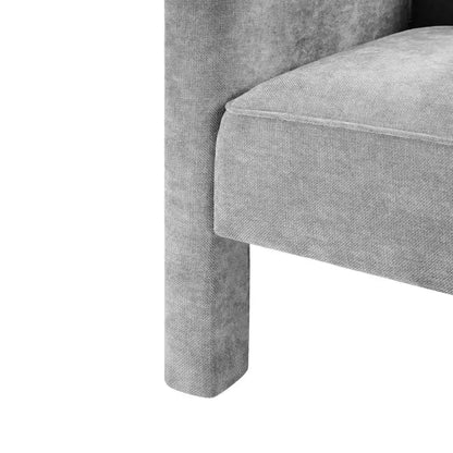 Poltrona di design moderna in ciniglia con schienale avvolgente e braccioli integrati