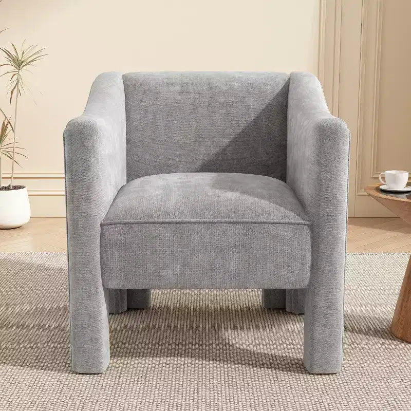 Poltrona di design moderna in ciniglia con schienale avvolgente e braccioli integrati